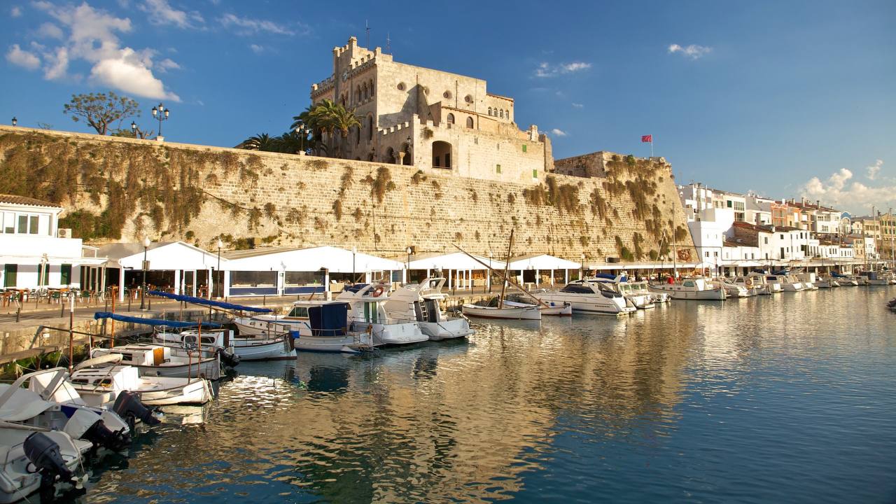 Menorca harbor with boats - Premium transfer service
